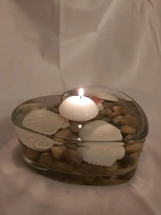 DIY floating heart candle made for less than $4 from Dollar Tree supplies. #diy #homedecor #floatingcandle #candle