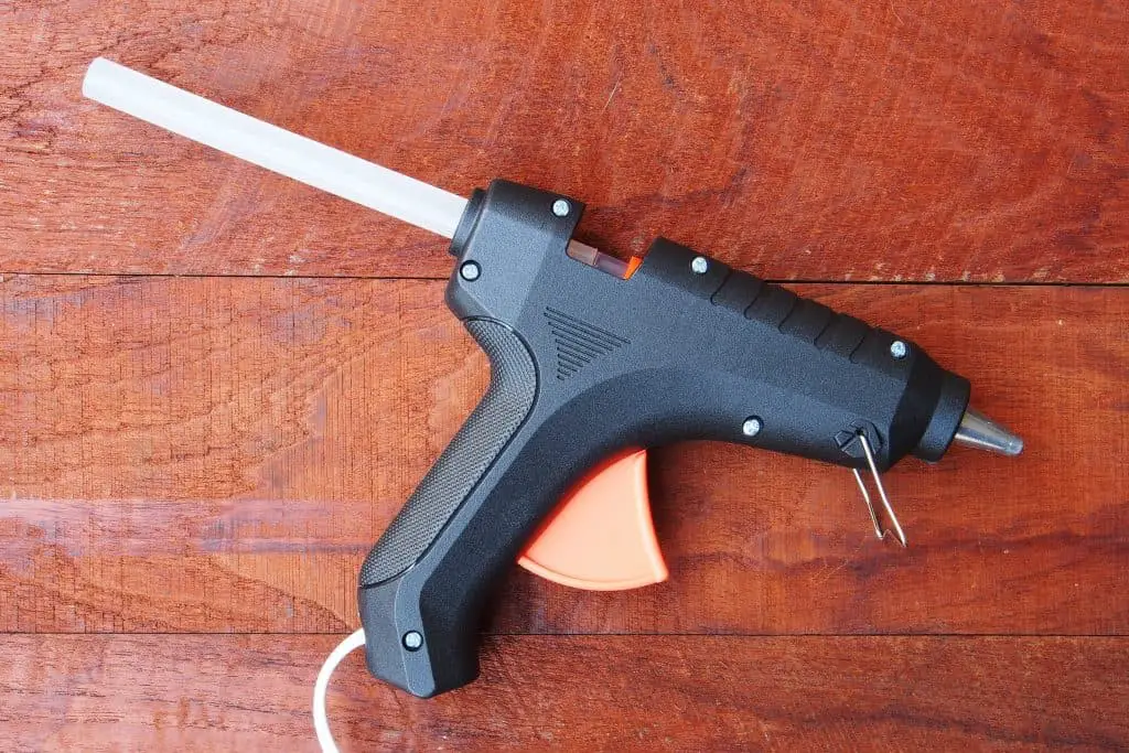 hot glue gun for securing candle wicks